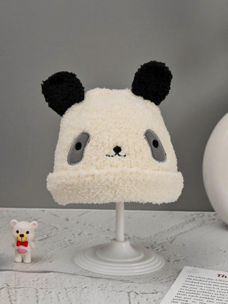 Cute panda-themed woolen beanie displayed on a stand, showcasing the animal face design and ear details.