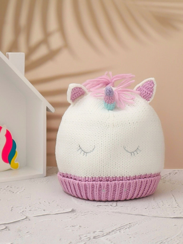 Child's White Knitted Unicorn Hat with Pink Accents and Horn