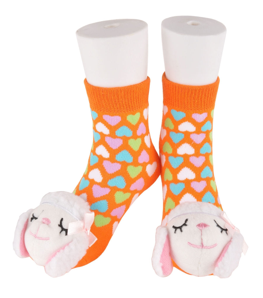 Cheerful orange toddler socks with a soft lamb toy attached - front view on a white background.