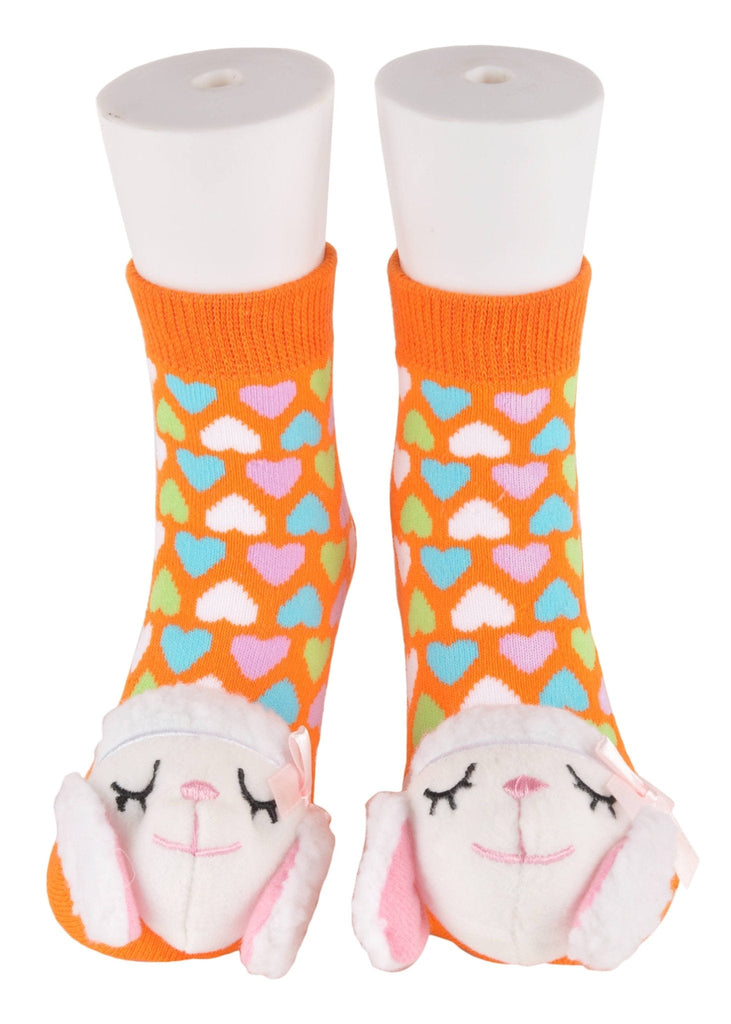 Playful toddler socks with lamb stuffed toy in orange with heart patterns - front view.