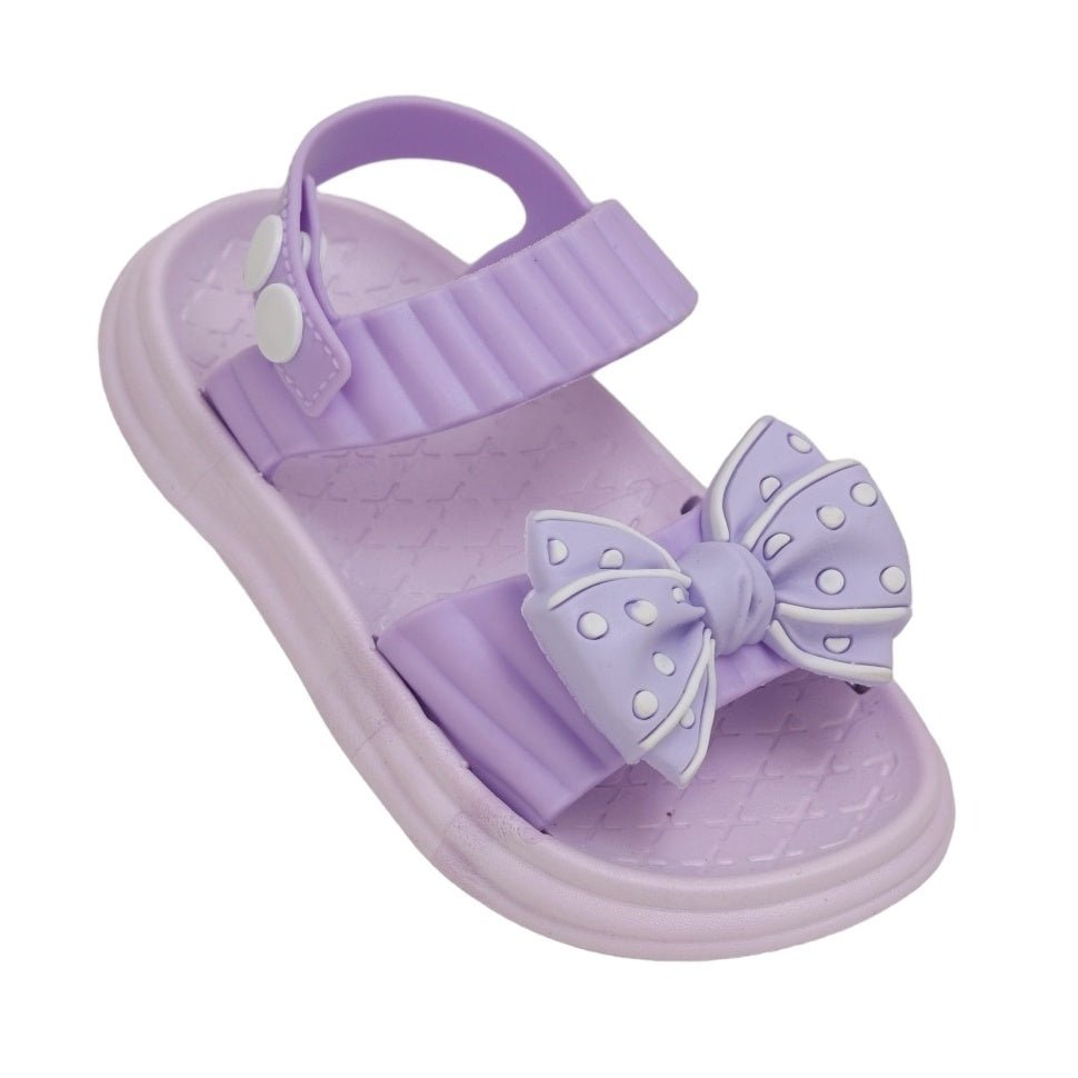 Single purple bow detail sandal showing the secure heel strap and whimsical bow design.