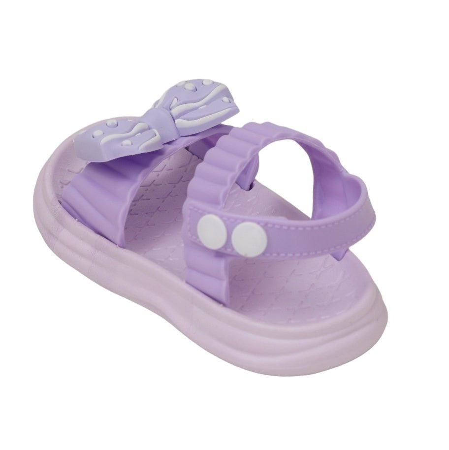 Top view of a purple bow detail sandal, highlighting the playful design and comfortable insole.