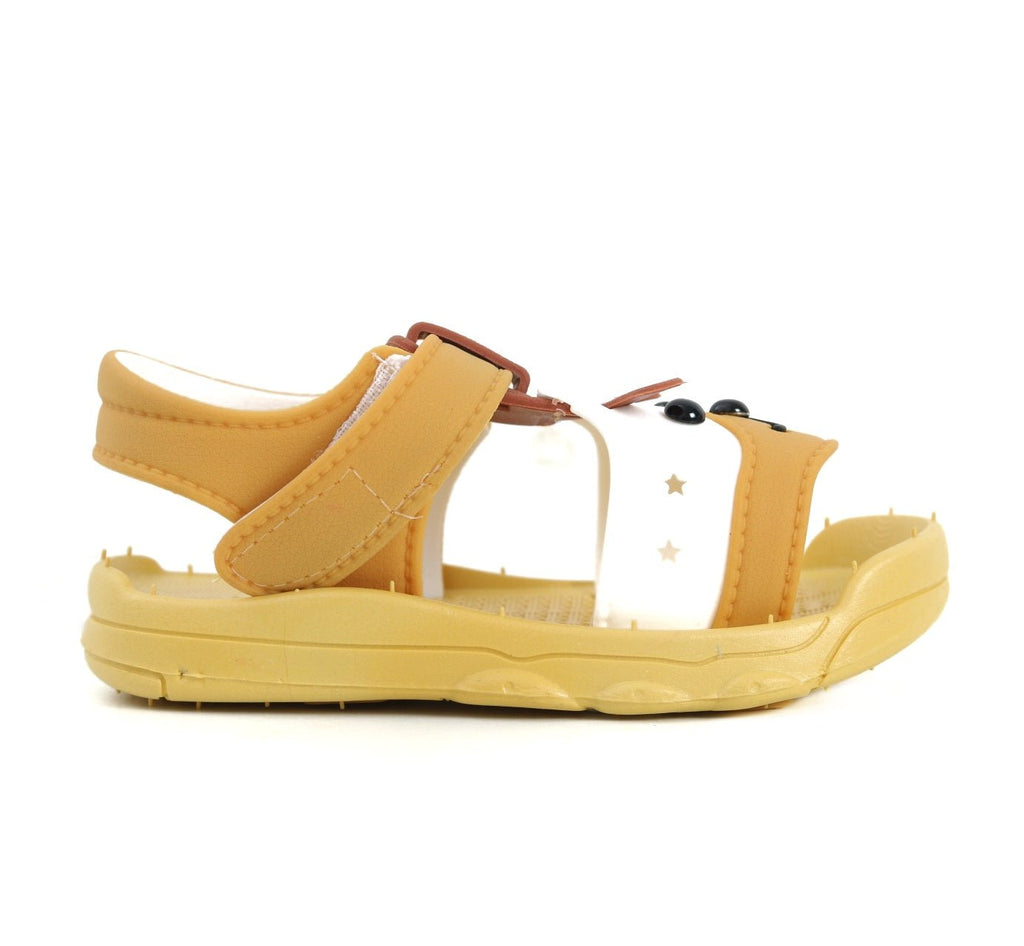 Side profile of yellow puppy sandals highlighting the comfortable strap and insole design.