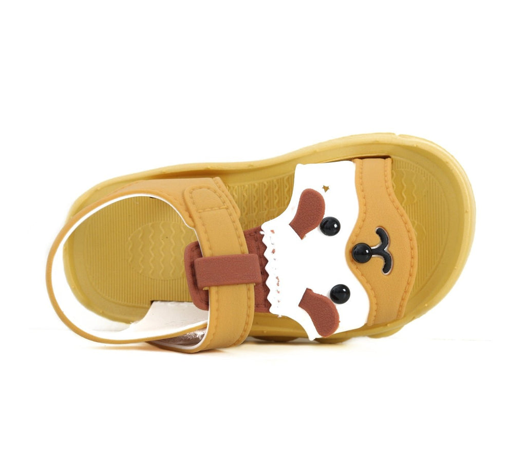 Insole view of yellow puppy sandals with puppy face detail, focusing on the comfort and strap quality.