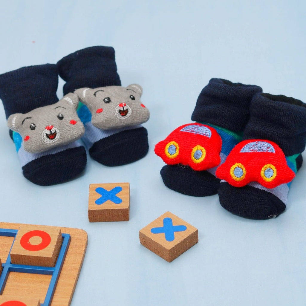 Baby boy’s car and puppy socks set displayed with toys, perfect for playful little ones.