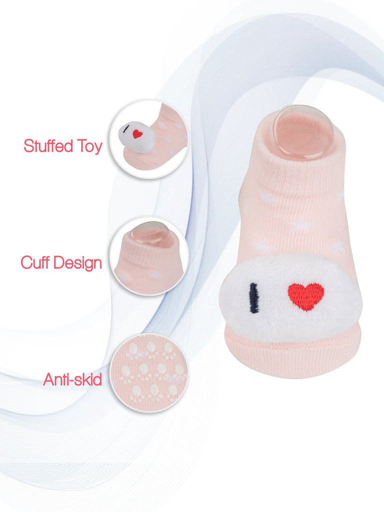 Detailed attributes of baby pink socks with "I love DAD" message, showcasing the stuffed toy and anti-skid properties by Yellow Bee.