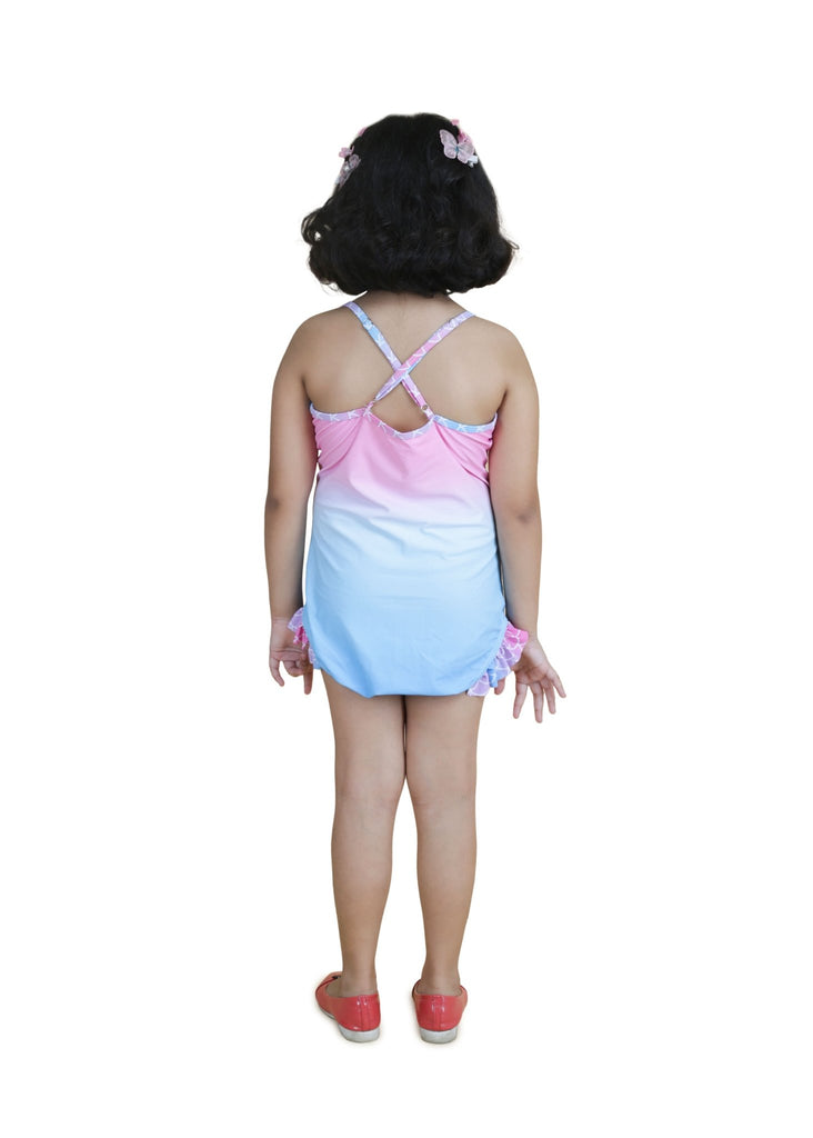 Back view of girl's mermaid swimsuit with criss-cross straps and ruffle detailing