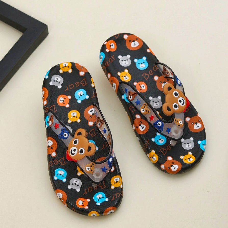 Playful black flip flops with a colorful all-over bear print for kids