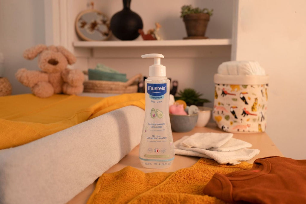 Mustela Baby Cleansing Water on a Cozy Nursery Changing Table