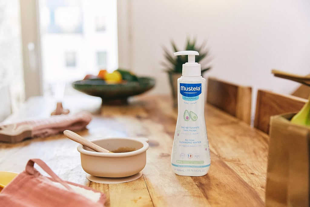 Mustela No Rinse Cleansing Water placed on a kitchen counter illustrating the product in a family environment