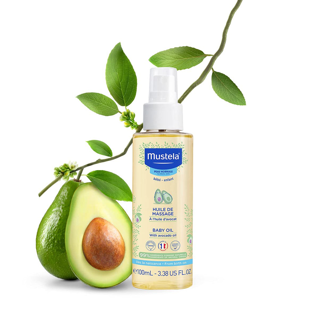 Mustela Baby Oil Bottle Next to Fresh Avocado Highlighting Natural Ingredients