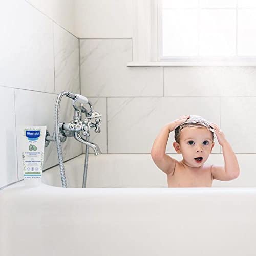 Adorable child enjoying a bath with Mustela Hair and Body Wash with avocado