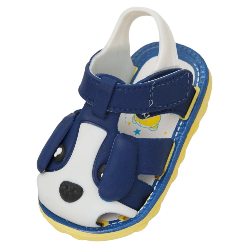Angled view of a blue puppy applique sandal with secure Velcro fastening for kids.