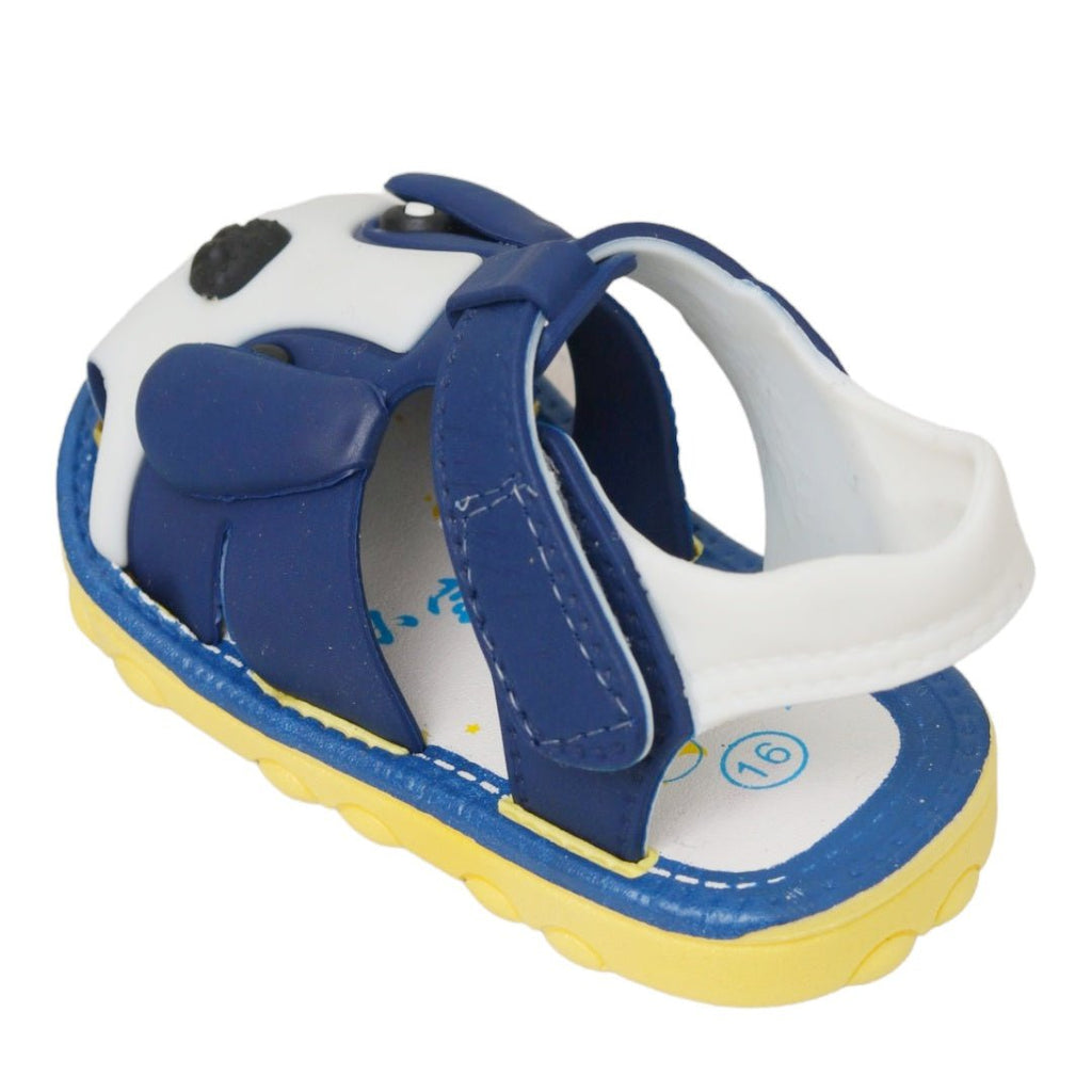 Side view of a kid's blue sandal with puppy design and Velcro strap.