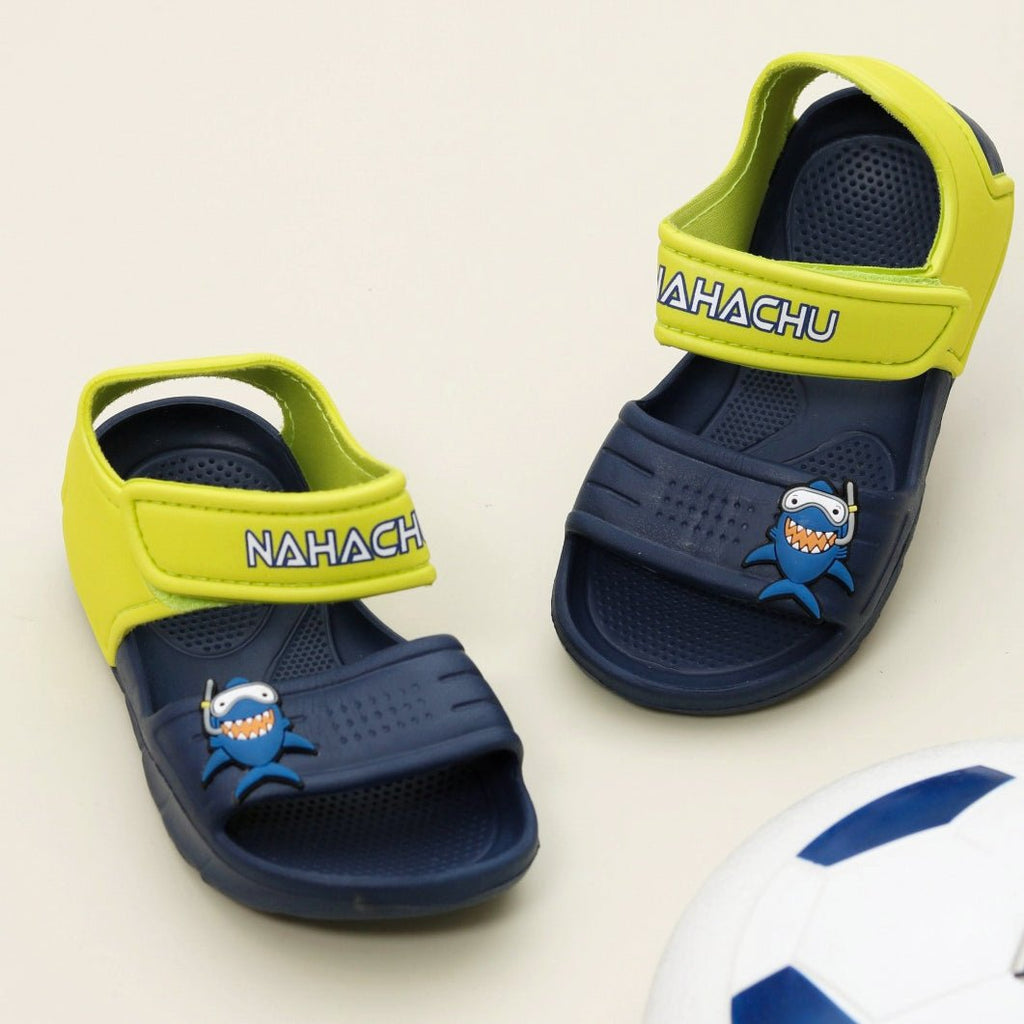 Kids' navy shark sandals with bright yellow accents and a fun cartoon design.
