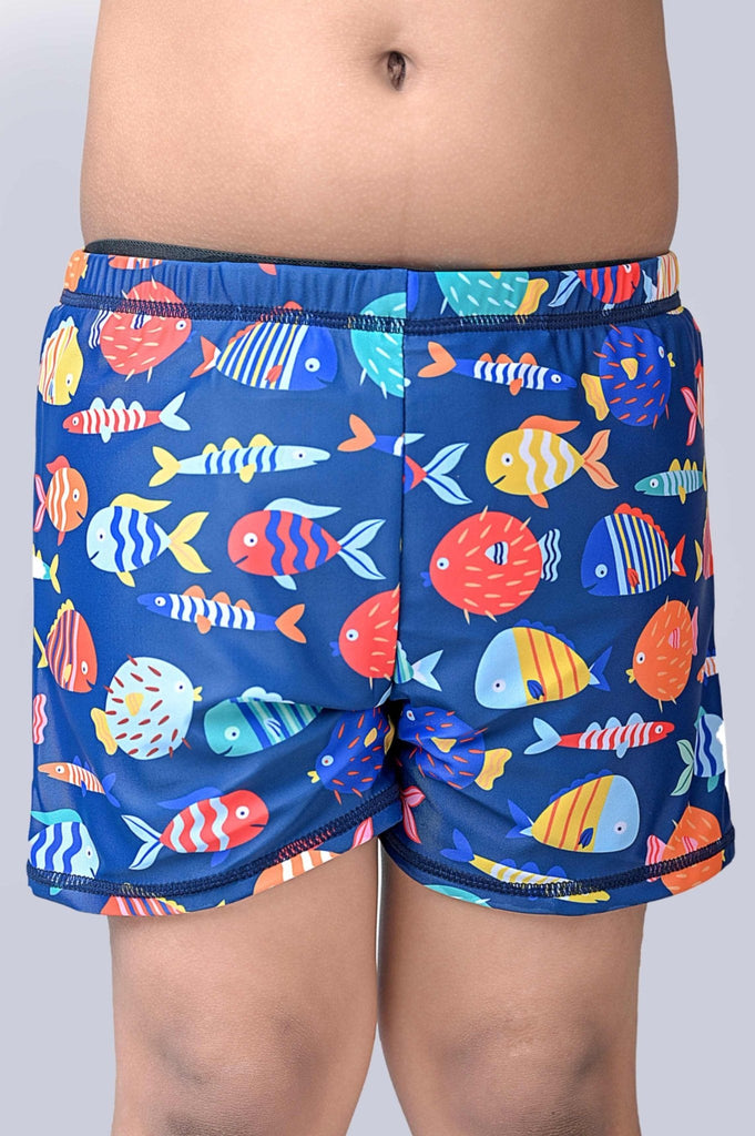 Close-up of navy blue swim shorts featuring an array of bright fish designs