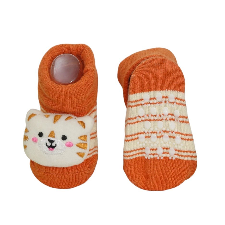 Side view of child's tiger-themed stuffed toy socks with anti-slip design