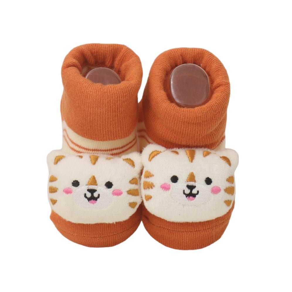Front view of child's tiger-themed stuffed toy socks in orange and white