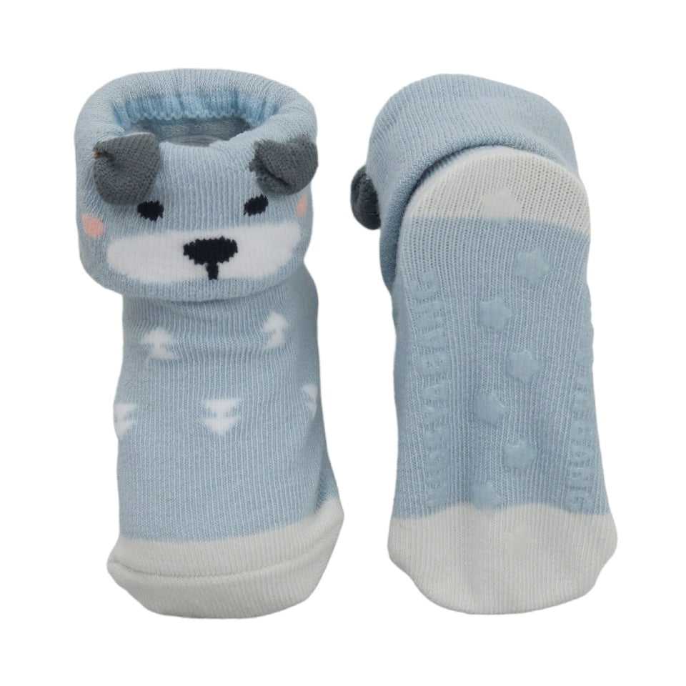 Close-up of blue baby socks with cloud pattern and bear design featuring anti-skid soles.