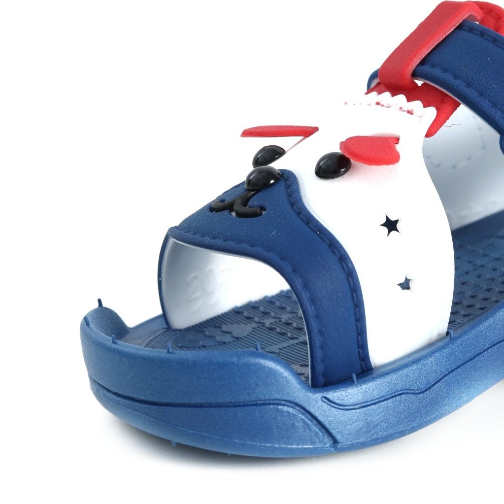 Close-up of Blue Puppy Sandal with puppy face design and textured sole for safe play.