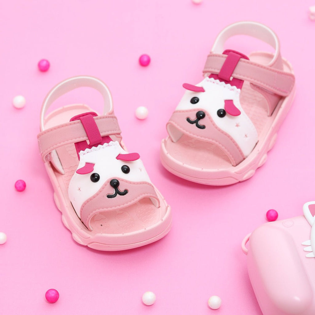 Adorable toddler pink puppy sandals with a playful design and pink straps.