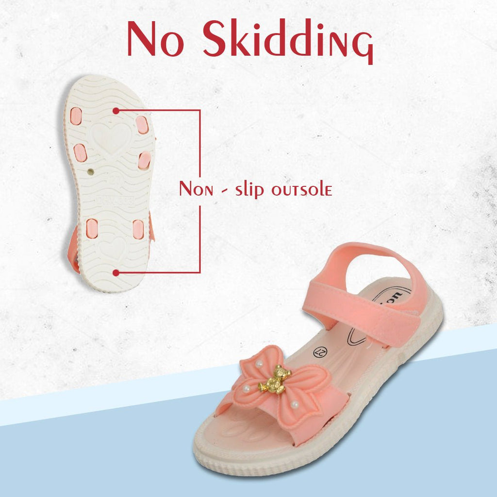 Non-slip outsole of peach toddler sandals with heart-shaped patterns for safety