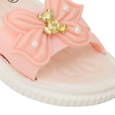 Close-up of the cute bear appliqué on the peach-coloured sandal's strap