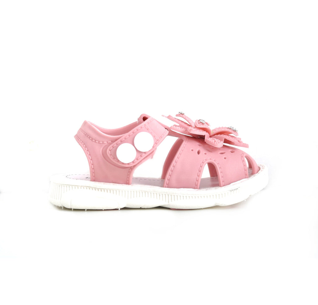 Angled view of a pink child's sandal with flower embellishments and a comfortable footbed.