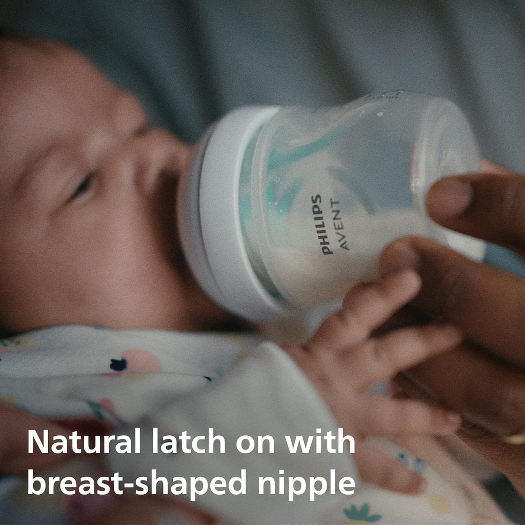 Baby achieving natural latch on the breast-shaped nipple of Philips Avent SCY670/01 bottle.