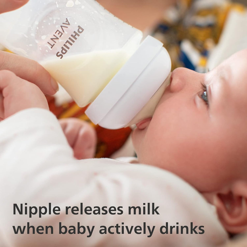 Baby drinking milk from Philips Avent Natural Response Bottle showing active drinking technology