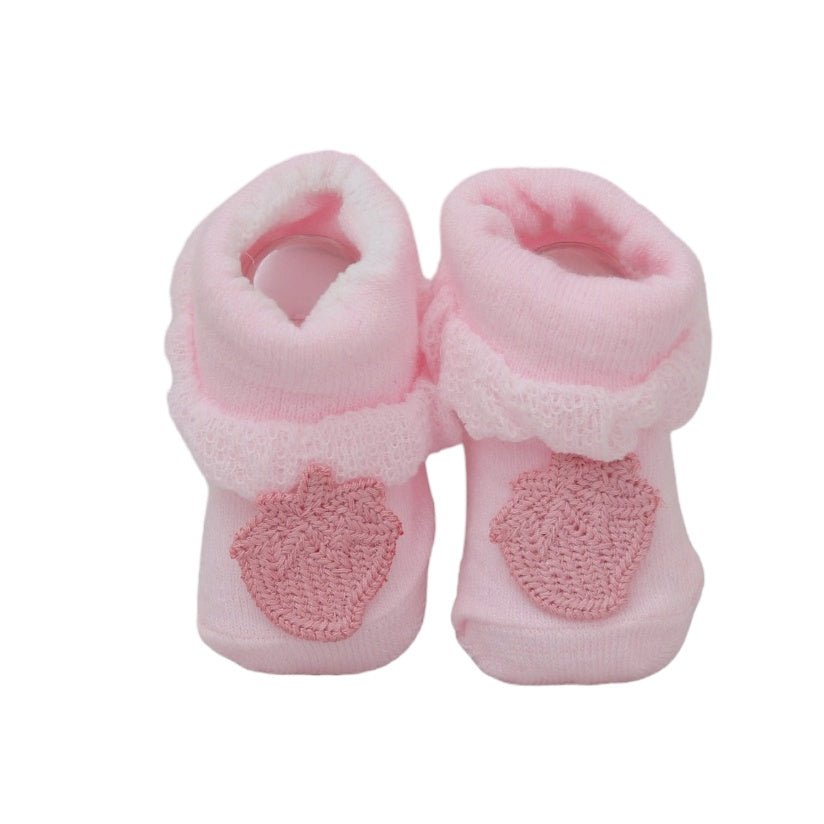 Cute baby girl's pink socks with mango detailing, presented in a front-facing view.