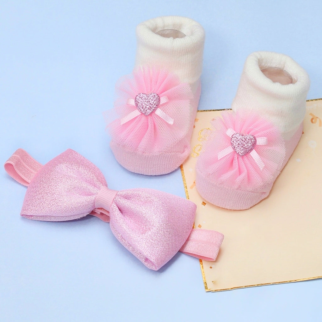Pink Ruffle Socks and Bow Headband Set by Yellow Bee on Blue Background