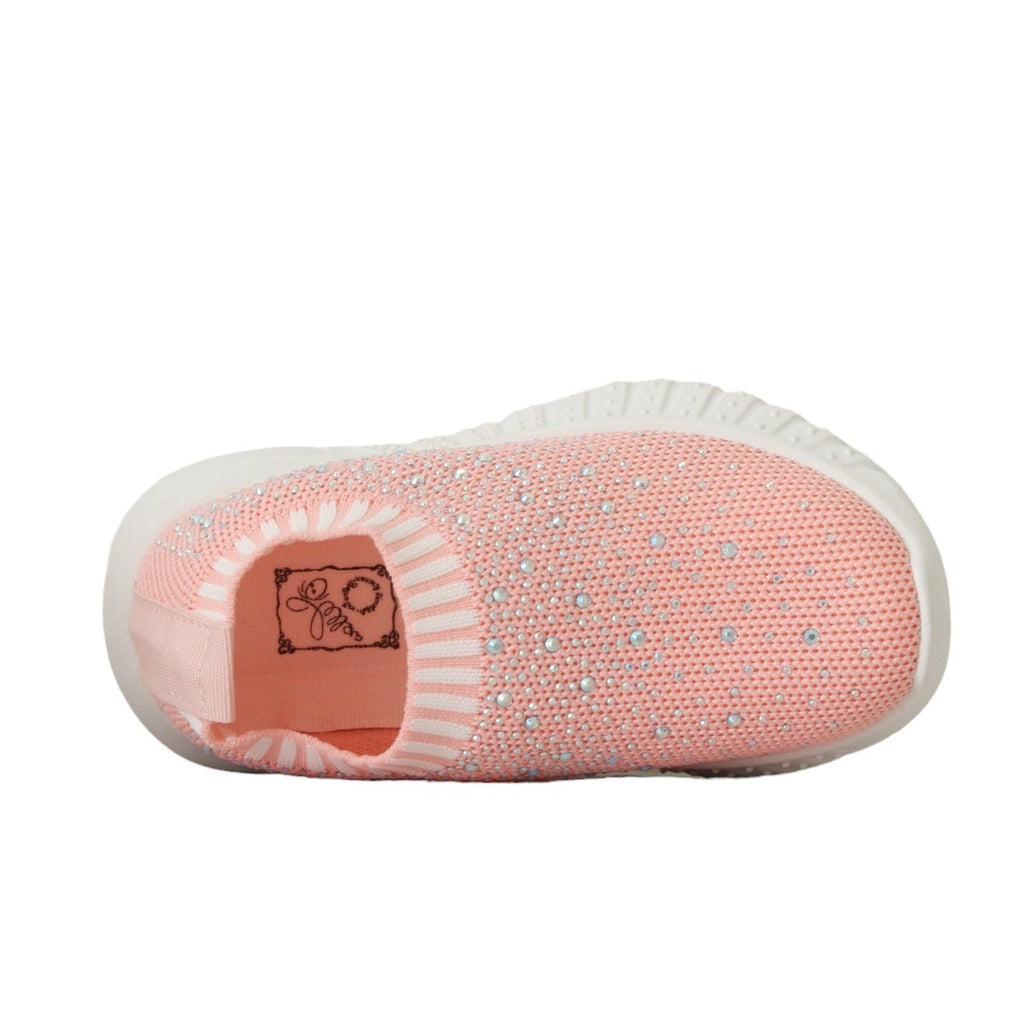 Top  view of children's pink soft knit slip-on shoes with textured details.