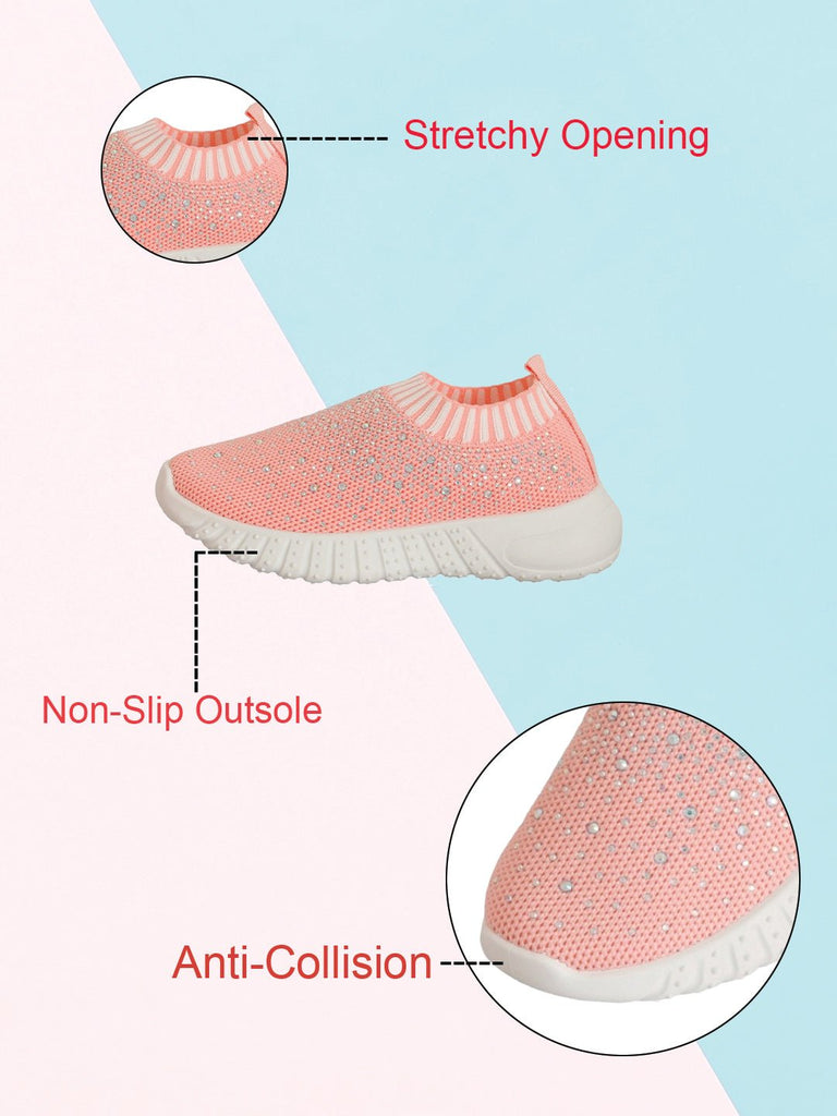 Detailed image of the soft knit upper with glitter accents on pink slip-on shoes for kids.