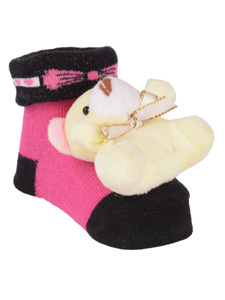 Side view of pink teddy bear stuffed toy socks showing the bear and ribbed cuff