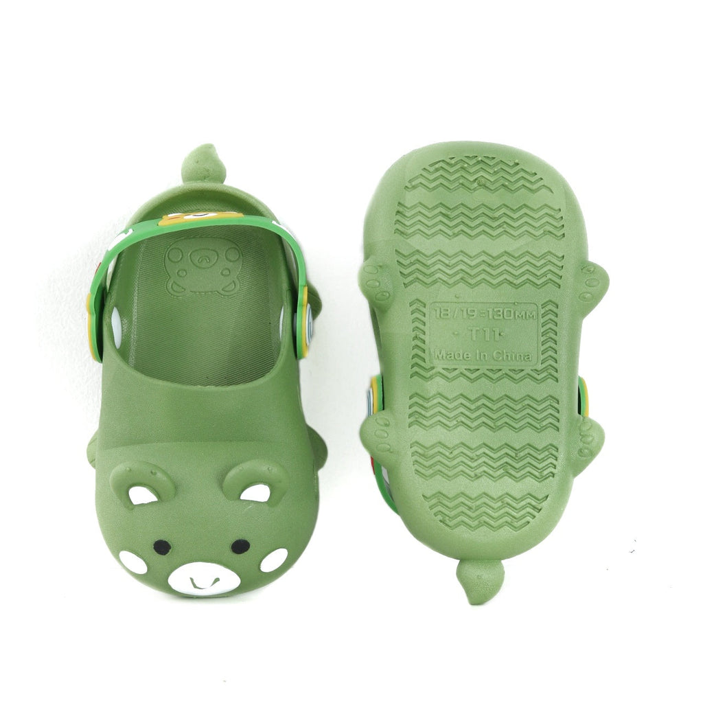 Bottom view of a green bear pattern clog showing the textured sole for grip