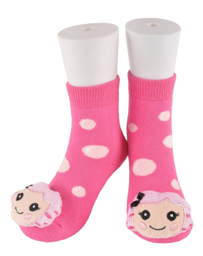 Assorted baby socks with cute animal faces displayed on soft fabric