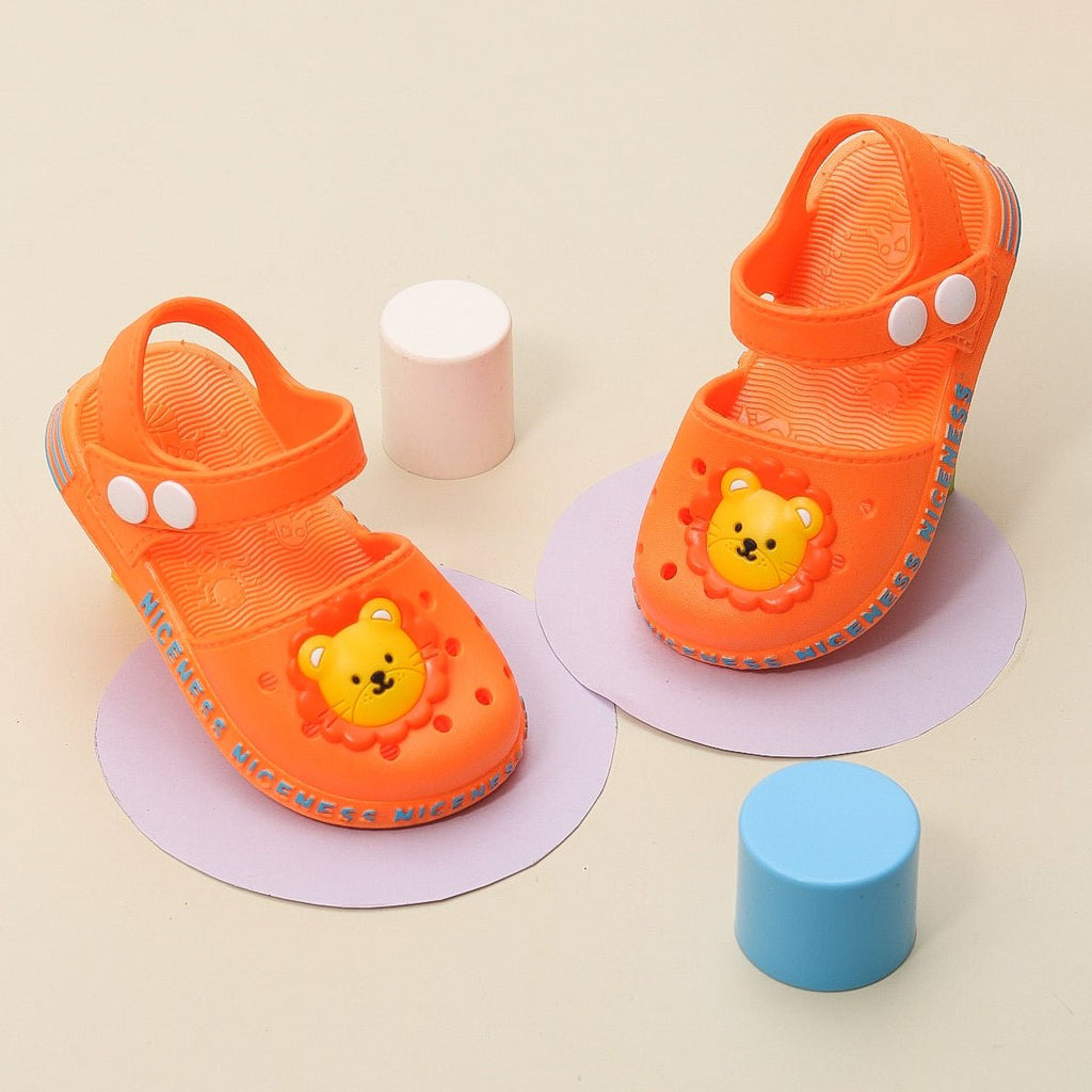 Front view of cute lion sandals in bright orange.