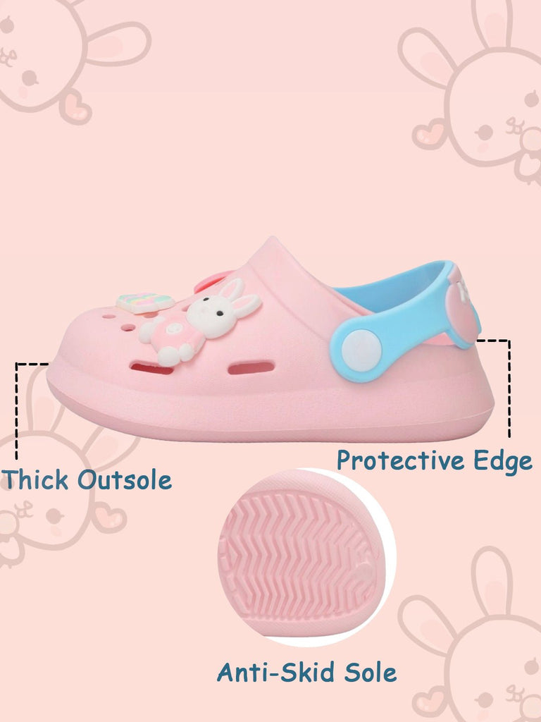Close-up of the anti-skid sole on pink bunny motif children's clogs.