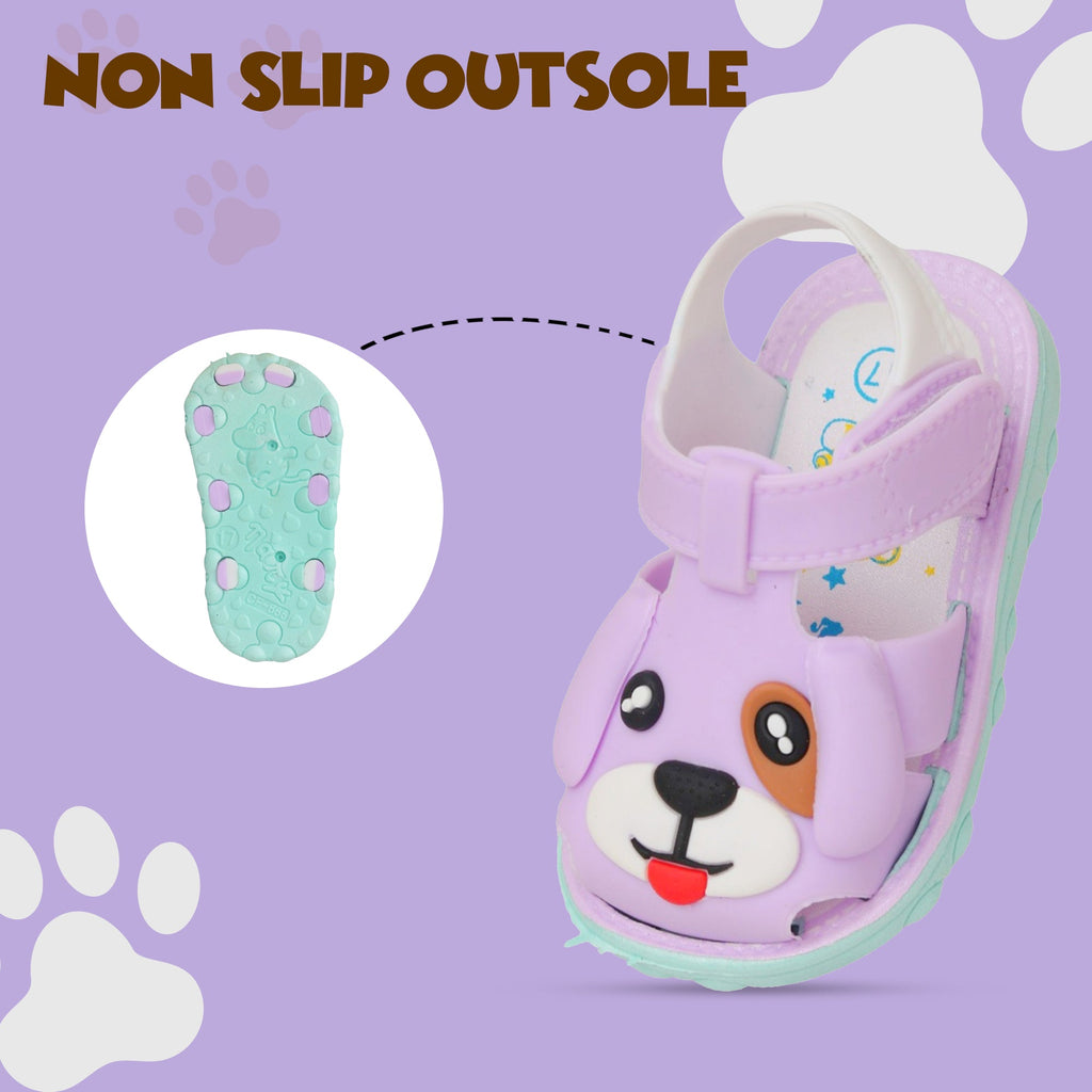 Non-slip outsole of purple puppy kids' sandals for secure and playful steps.