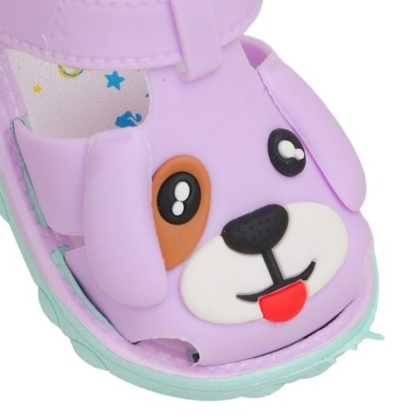 Close-up of the cute puppy face on purple applique kids' sandals.