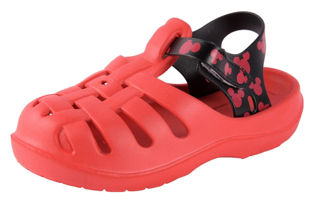 A dynamic angle view showcasing the bright red hue and detailed strap design of the boys' clogs