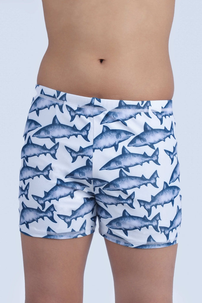 Detailed view of Yellow Bee boys' swim shorts with dynamic shark pattern