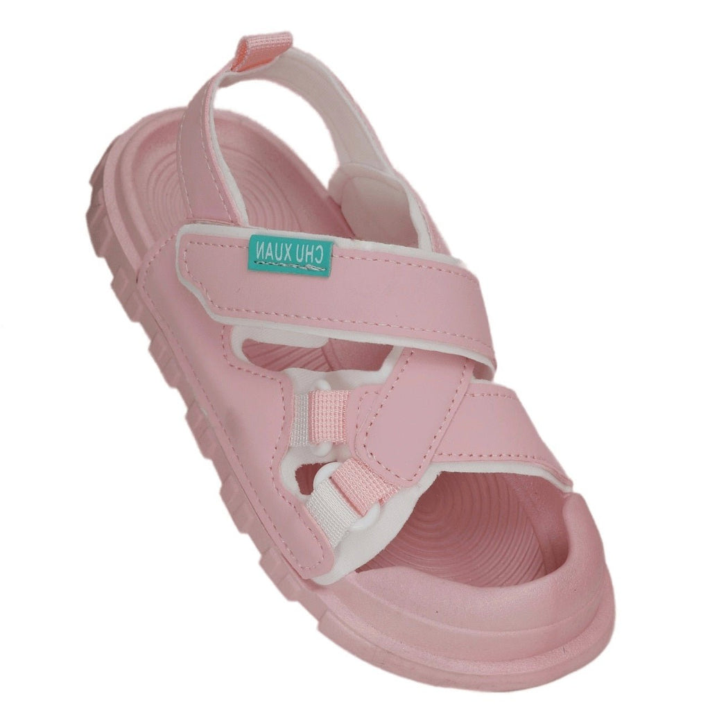 Side angle of soft pink children's sandals showcasing the hook and loop strap closure.