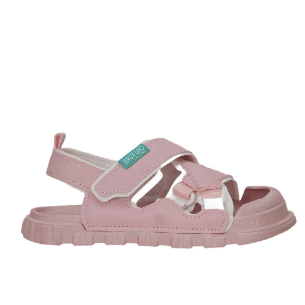 Full profile view of pink children's casual sandals highlighting the treaded sole for safety