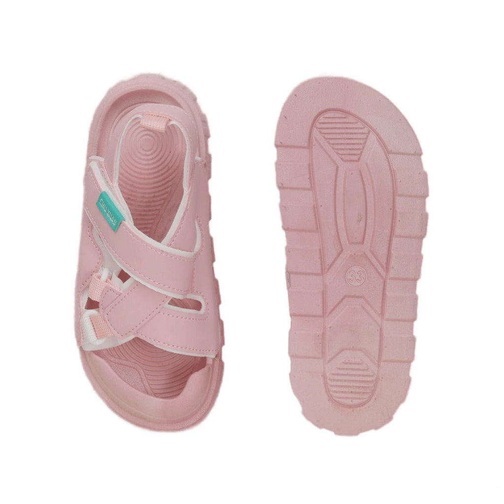 Sole view of a pink sandal for kids emphasizing the anti-slip design for active play