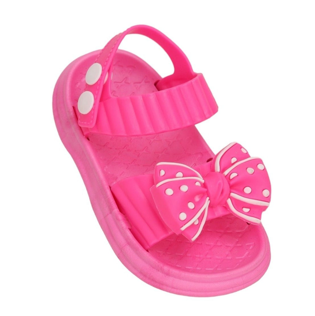 A single dark pink bow detail sandal with a cute polka dot pattern, designed for stylish comfort.