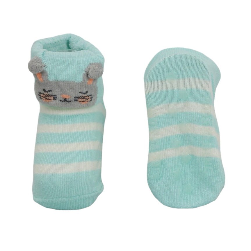 One blue striped bunny design sock next to a plain sock for baby girls.