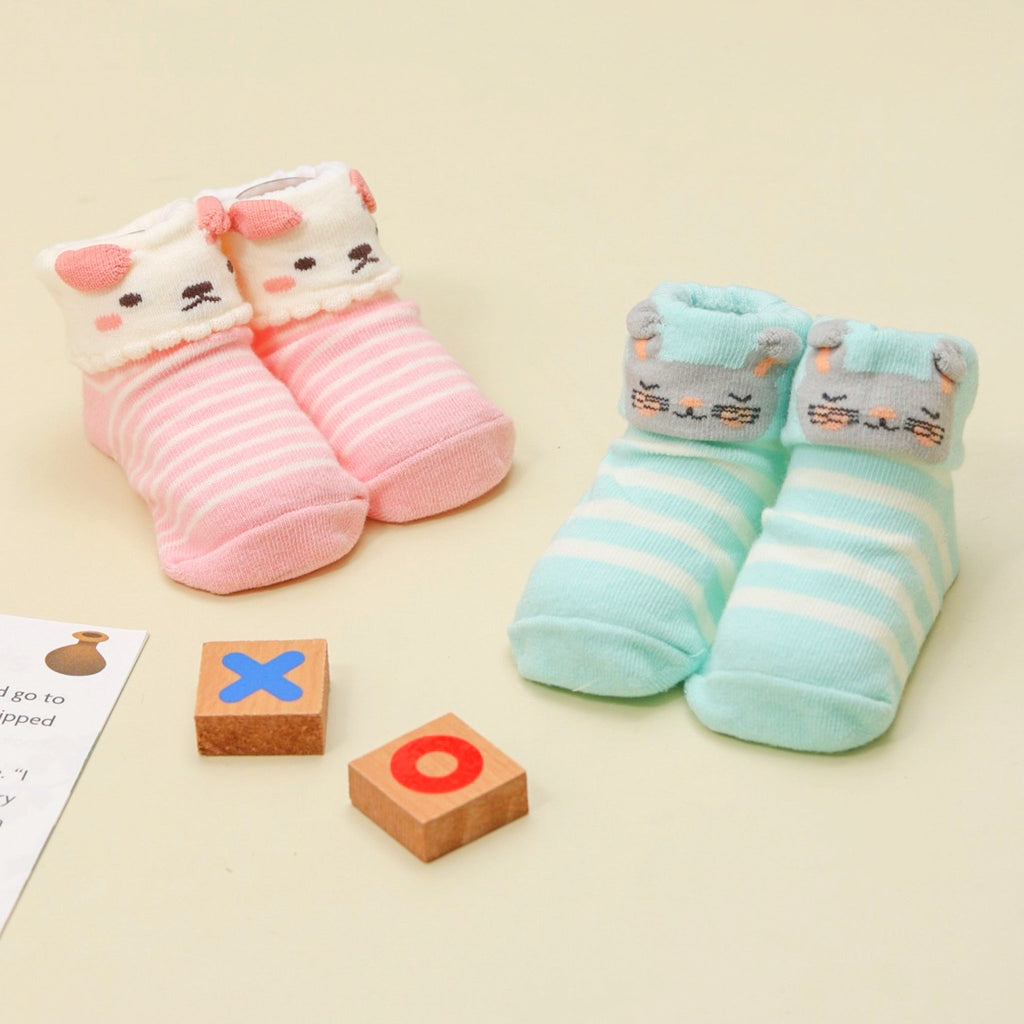 Assorted set of pink and blue striped socks with puppy and bunny designs for baby girls.