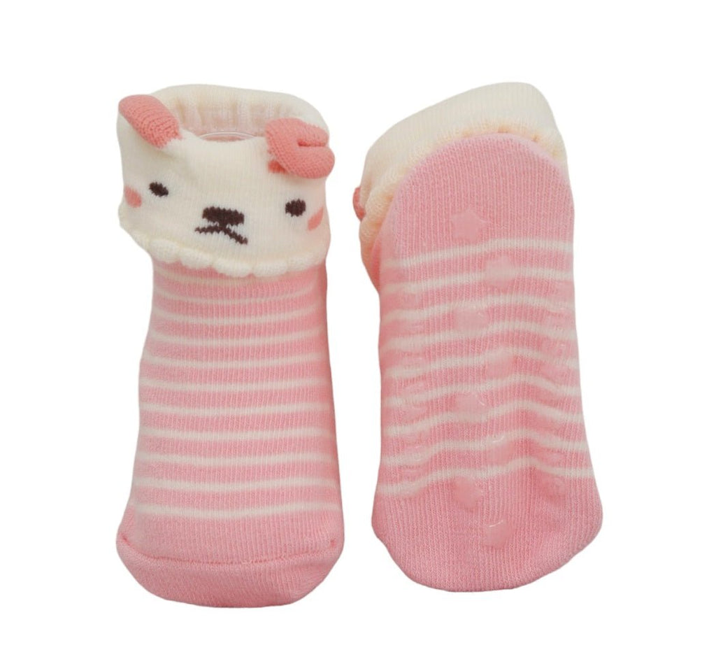 One pink striped puppy design sock next to a plain sock for baby girls.